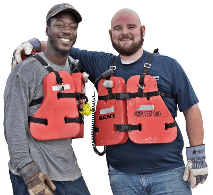 two men in life jackets standing together