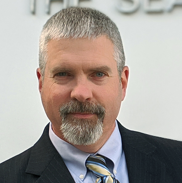 white man with goatee smiling